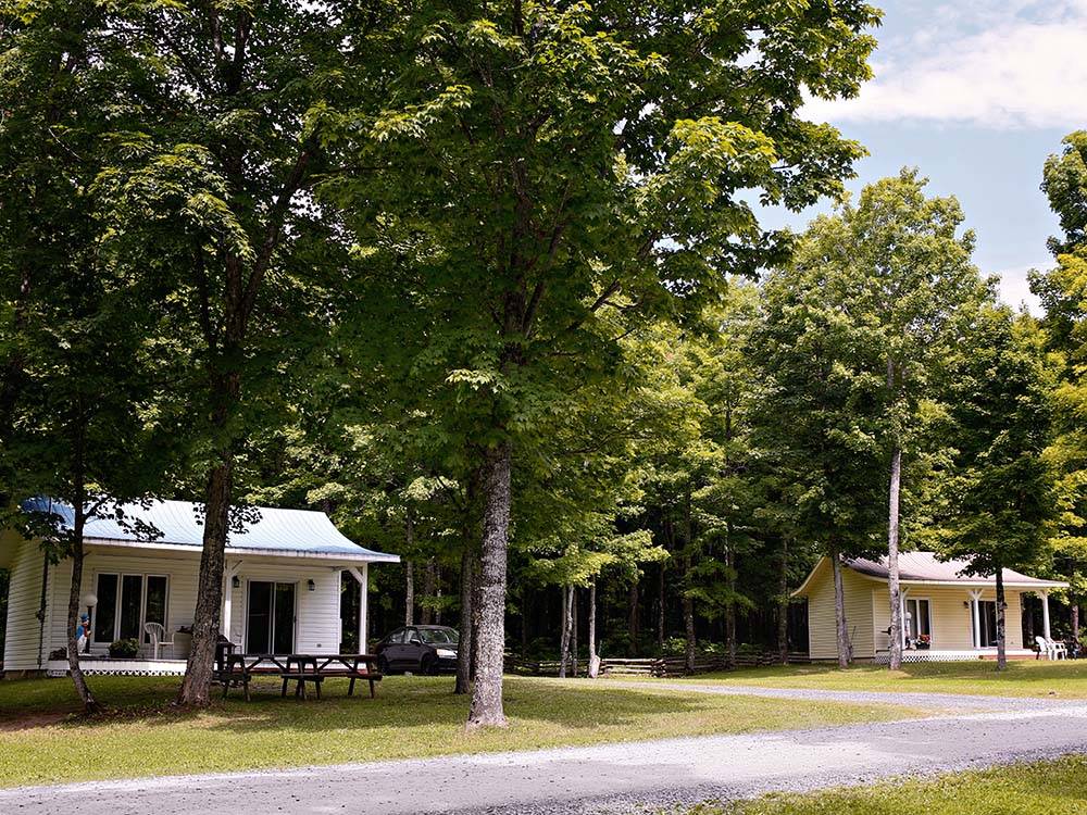Two of the campground cottages at CAMPING PARADIS DE LA P'TITE MONTAGNE