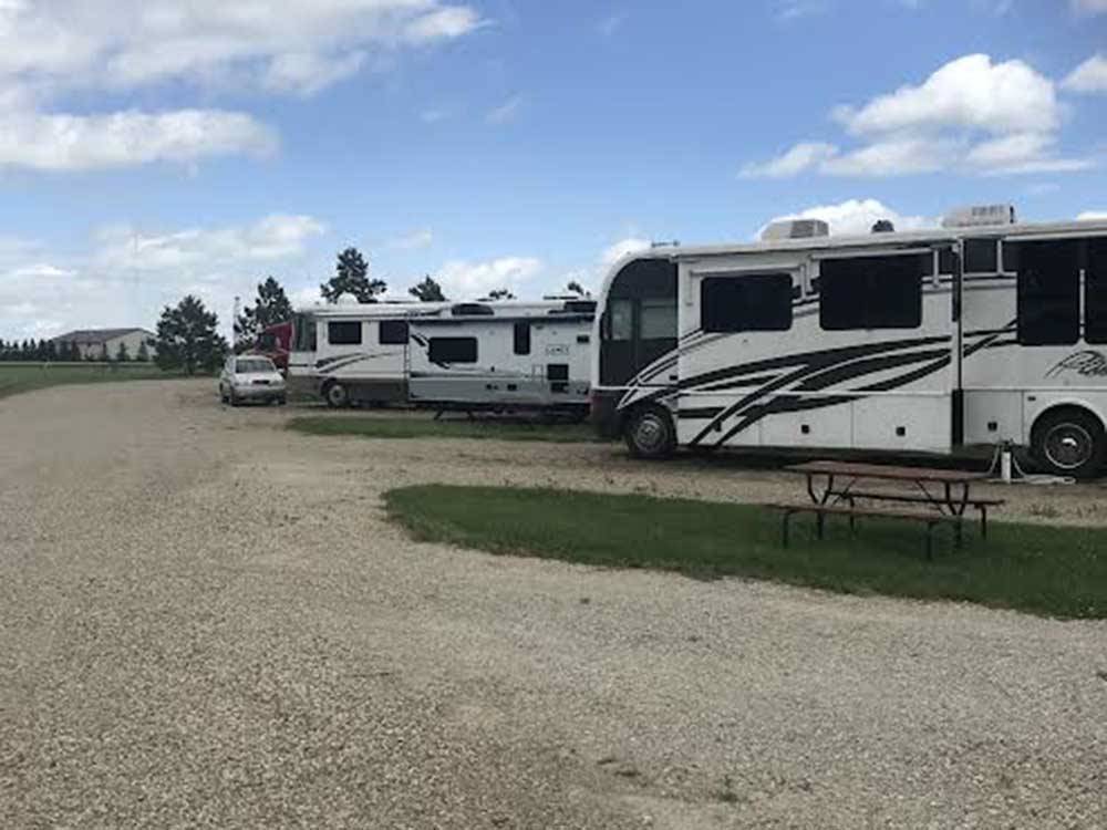 Gravel road and RV sites  at A PRAIRIE BREEZE RV PARK