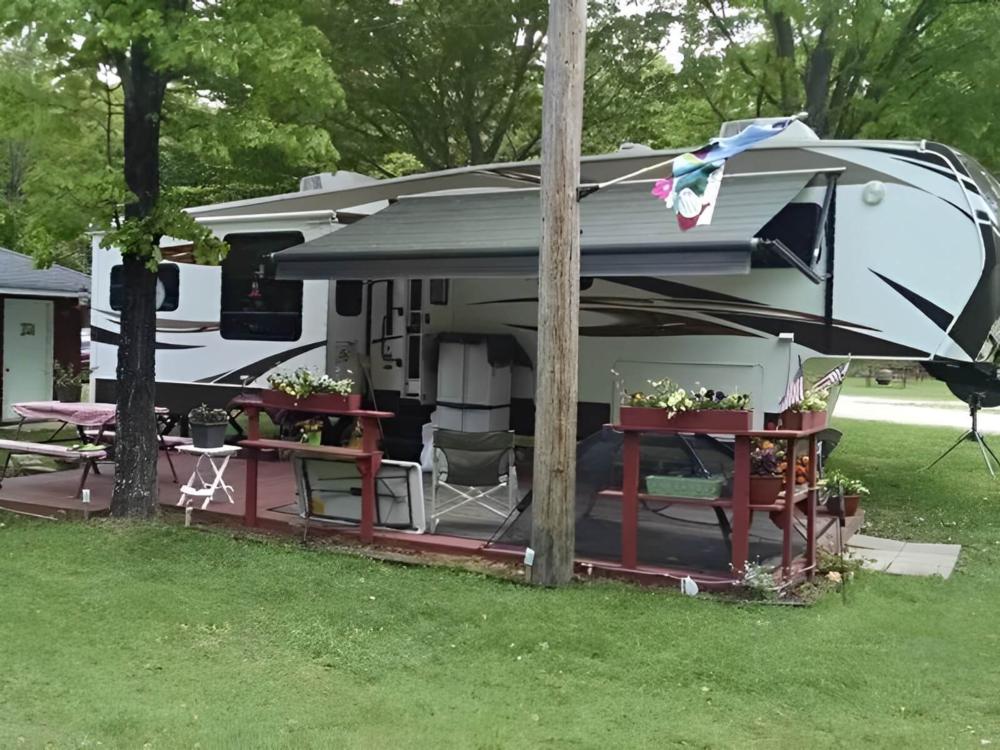 Parked trailer with covered patio at Indian Lake RV Resort