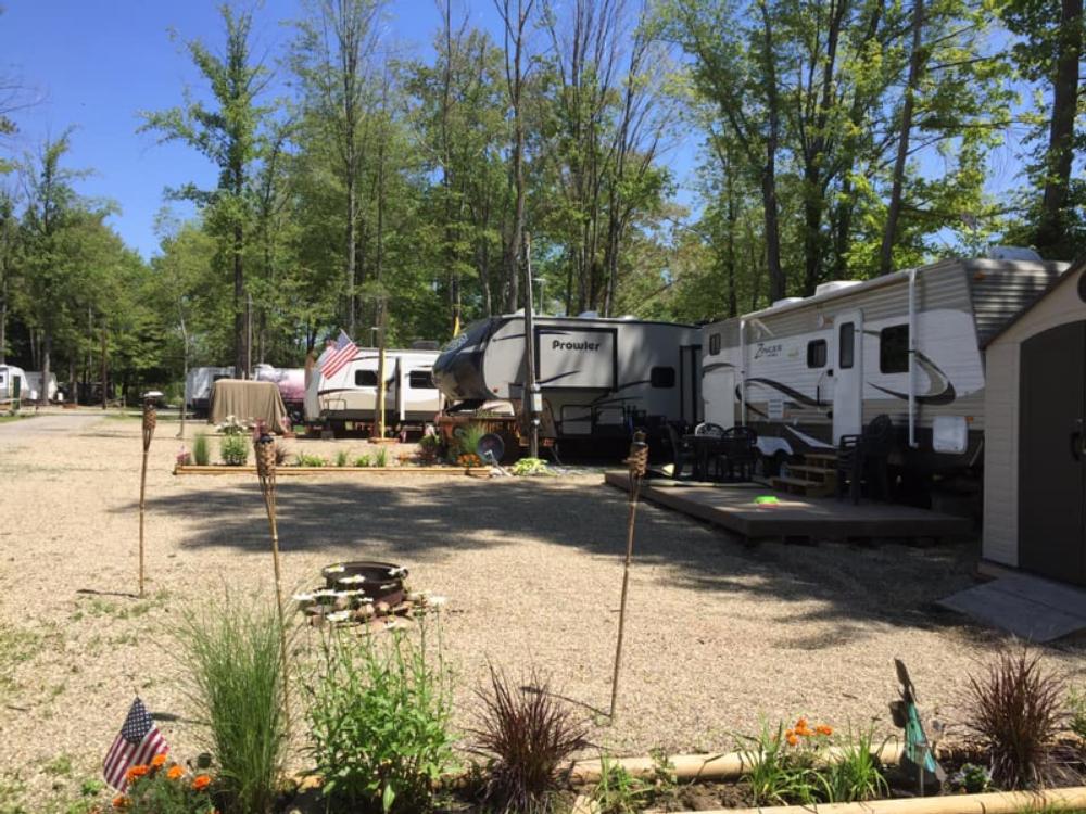 RV sits among trees at Country Acres Campground