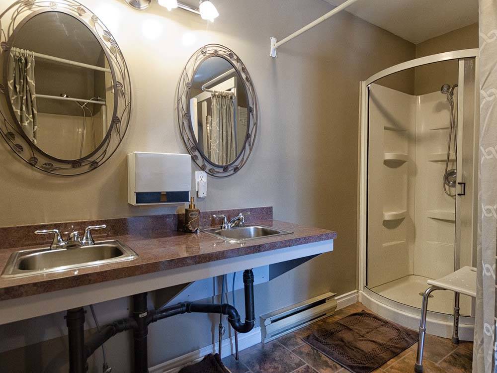 Restroom sinks and shower at ARROWHEAD RV PARK