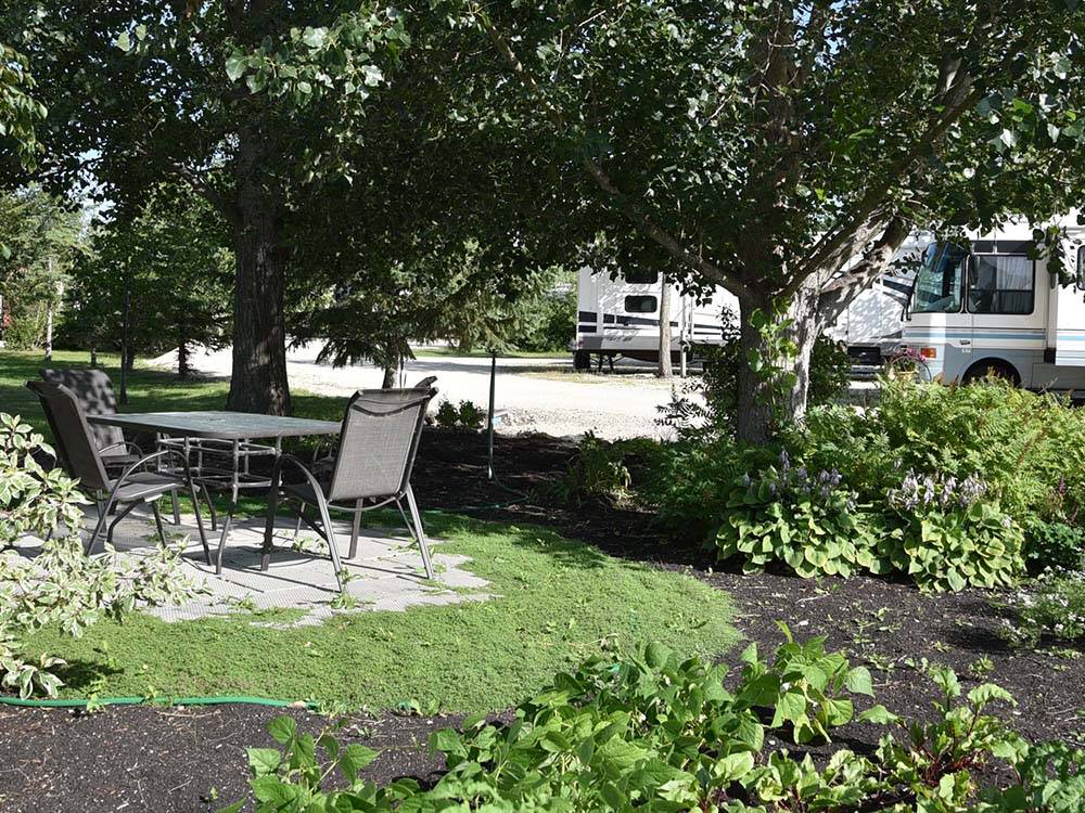 Outdoor seating area with table at ARROWHEAD RV PARK