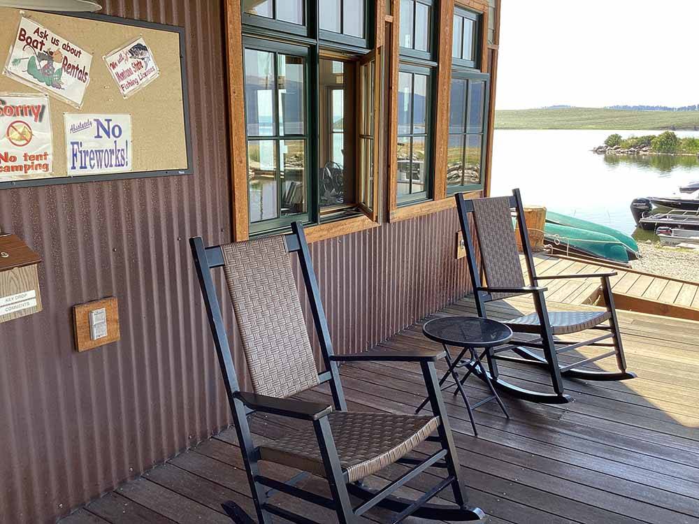 A couple of rocking chairs on the deck at YELLOWSTONE HOLIDAY RV CAMPGROUND & MARINA