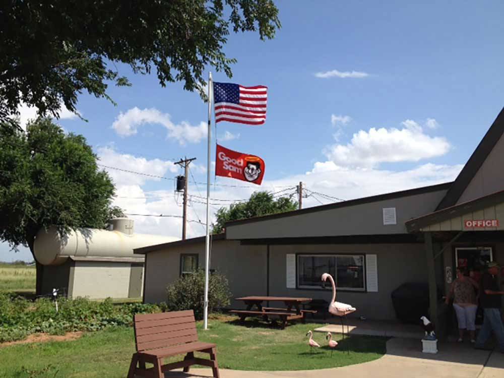 USA and Good Sam flags flying at office at TRAVELER'S WORLD RV PARK