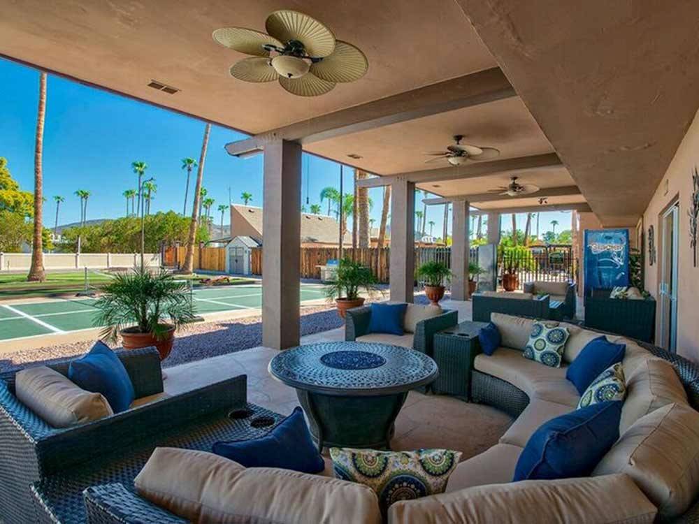 Patio area with U shaped couch and mosaic table at DESERTSCAPE
