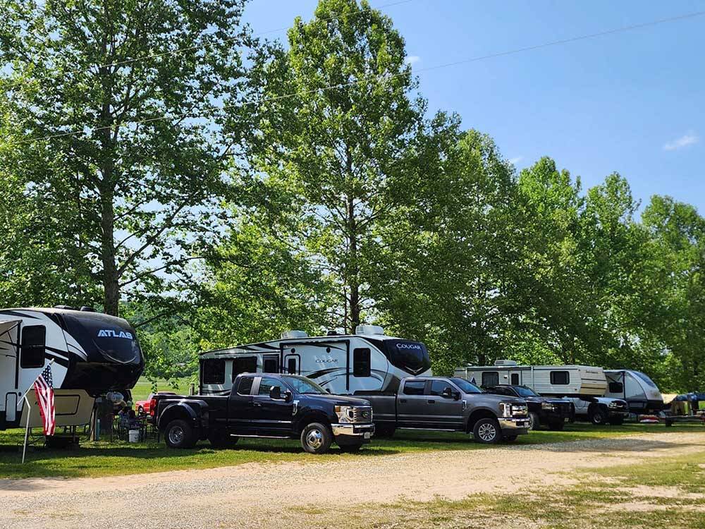 A row of trailers parked in sites at BSC OUTDOORS CAMPING & FLOAT TRIPS