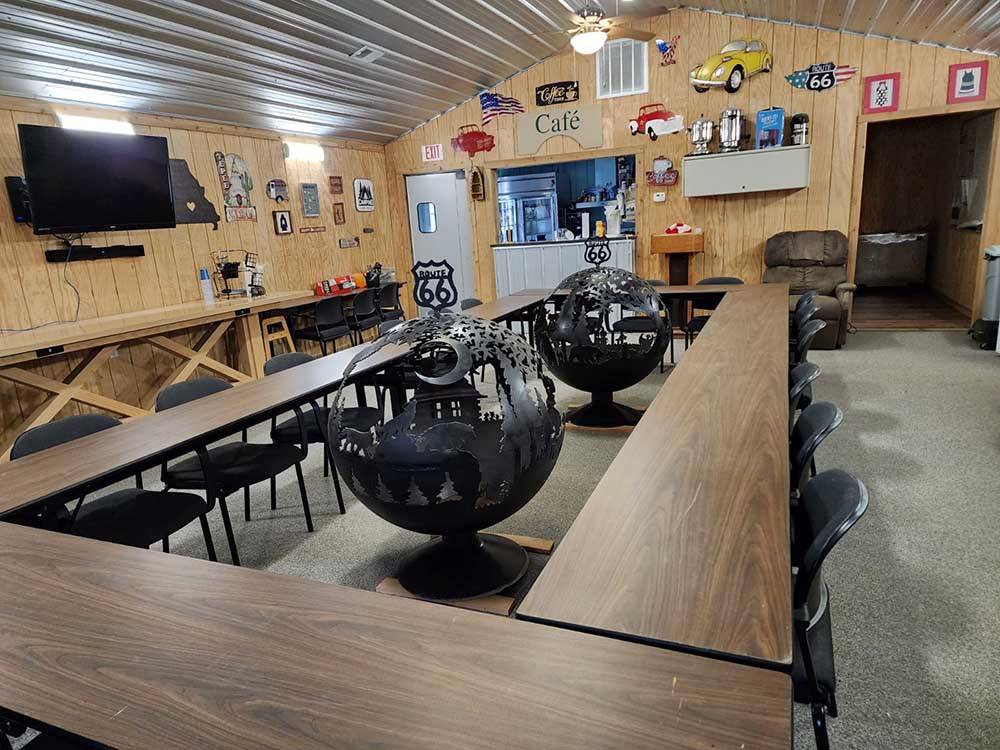 Two large metal sculptures in the middle of tables at BSC OUTDOORS CAMPING & FLOAT TRIPS