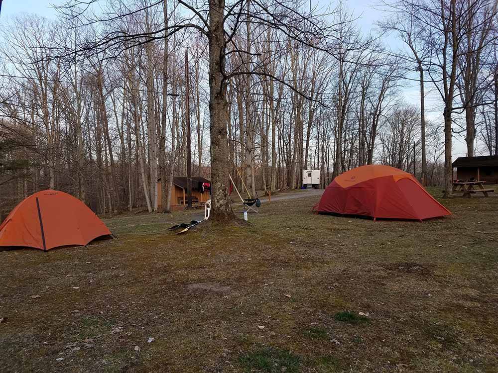 A couple of orange tents at RIFRAFTERS CAMPGROUND