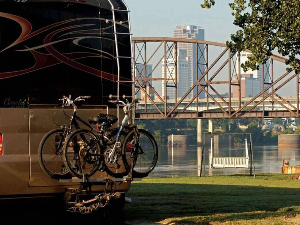 RV camping at park with view of water at DOWNTOWN RIVERSIDE RV PARK