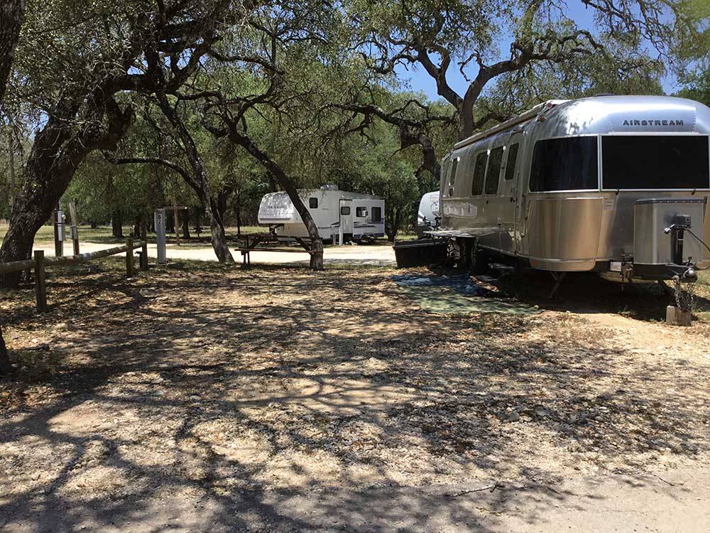 A couple of dirt RV sites at CASCADE CAVERNS & CAMPGROUND