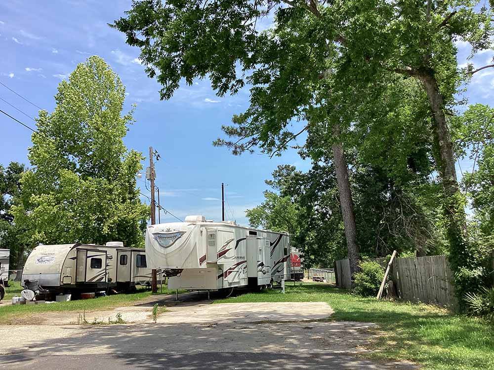 A row of gravel RV sites at TWELVE OAKS RV PARK