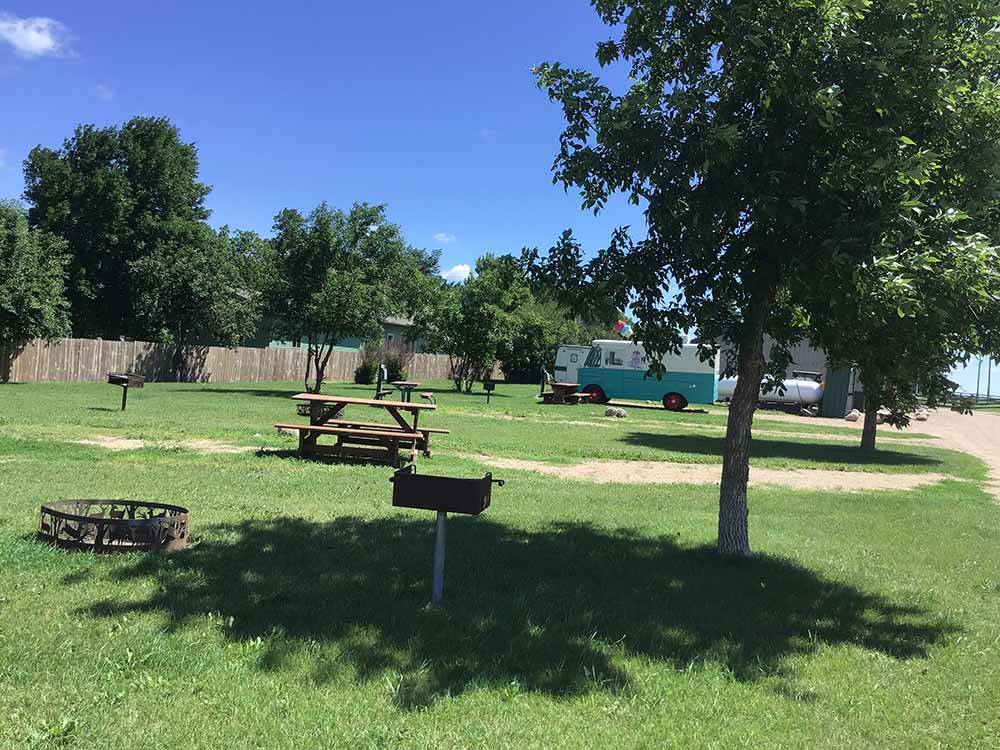 A group of grassy RV sites at COUNTY LINE RV PARK & CAMPGROUND