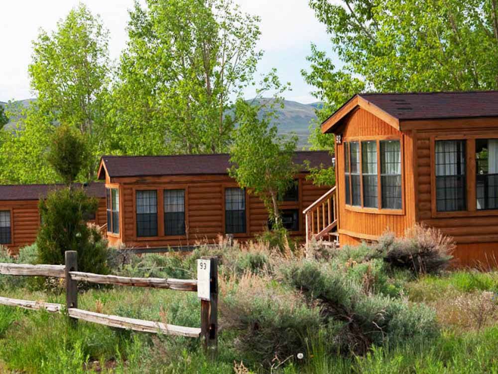 A row of wooden rentals at THOUSAND TRAILS BLUE MESA RECREATIONAL RANCH