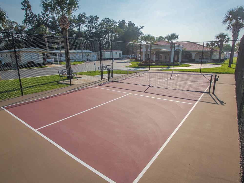 An open tennis court at JA-MAR TRAVEL PARK