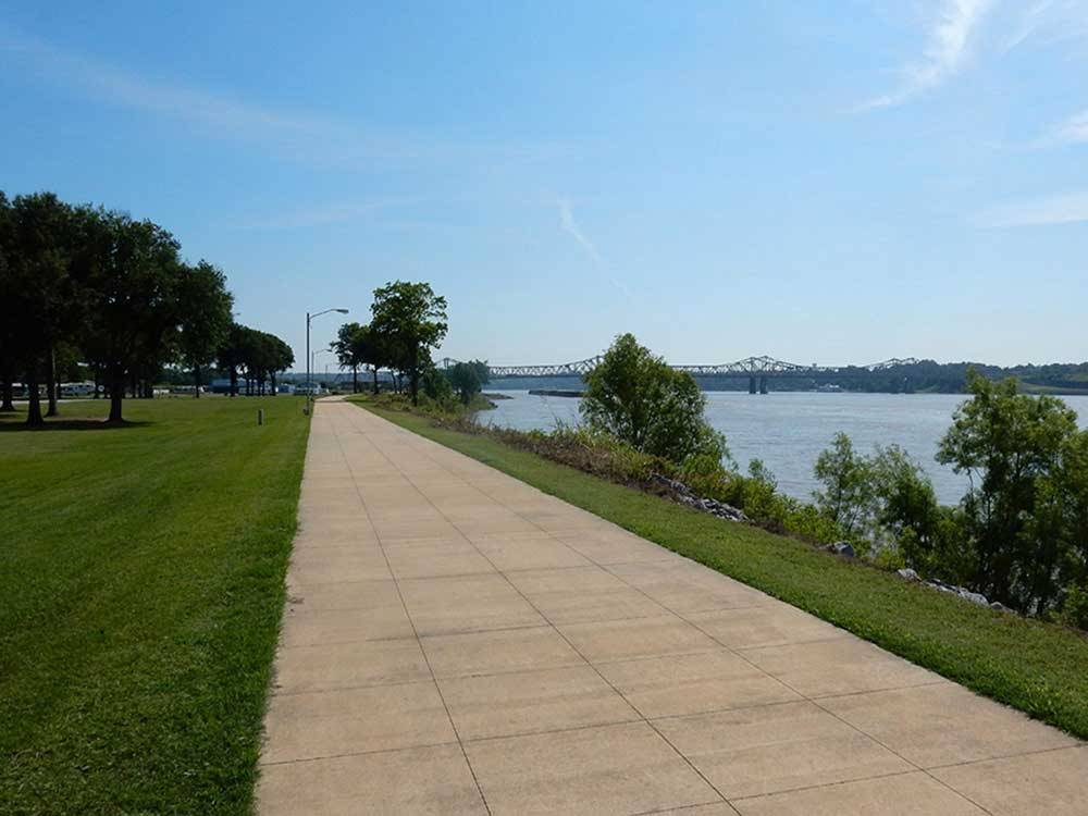 A walkway next to the water at RIVER VIEW RV PARK AND RESORT