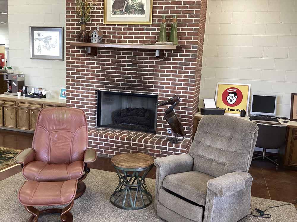 A sitting area by the fireplace at RIVER VIEW RV PARK AND RESORT