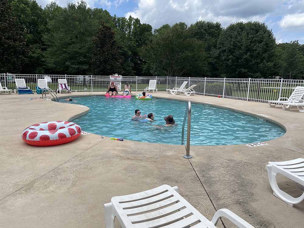 People playing in the pool at RIVER BOTTOM FARMS FAMILY CAMPGROUND