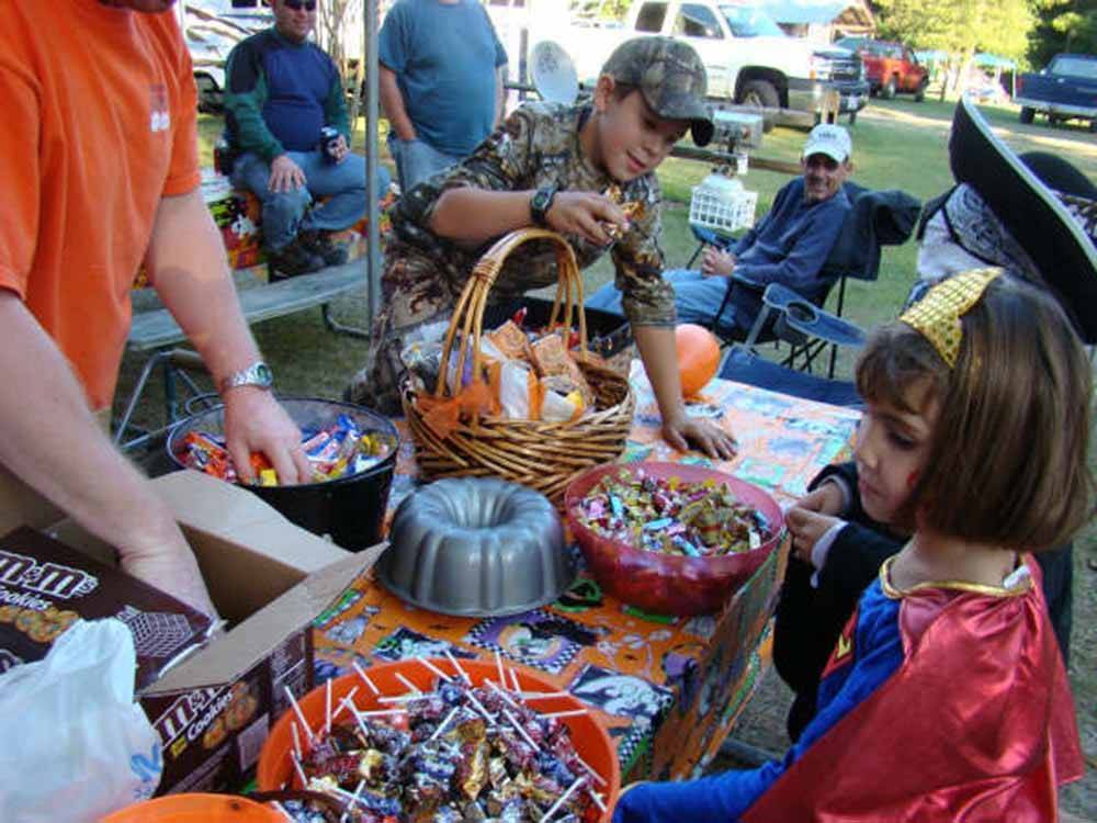 Kids in Halloween costumes trick or treating at RIVER BOTTOM FARMS FAMILY CAMPGROUND