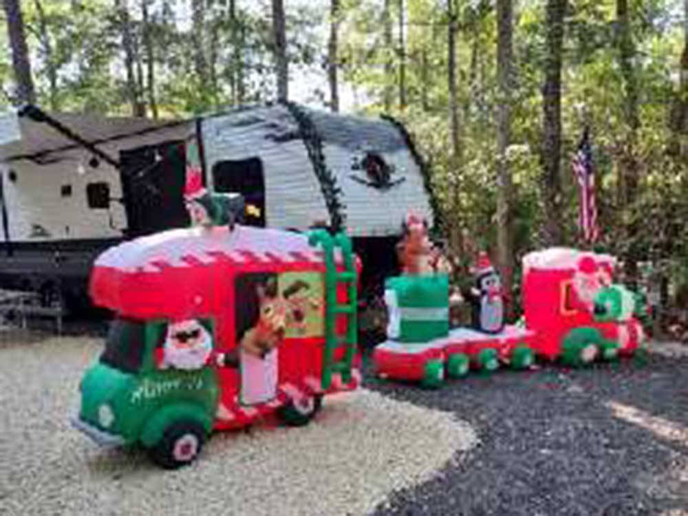 RV space adorned with Christmas decorations at OCEAN CITY CAMPGROUND AND BEACH CABINS