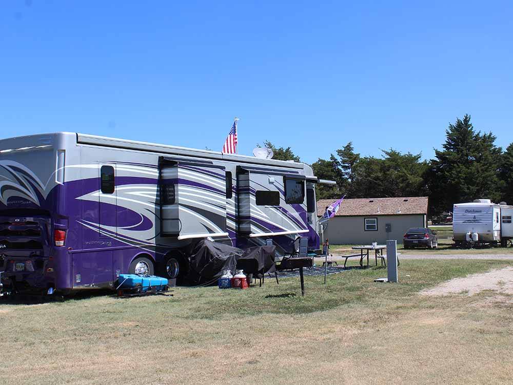 A large motorhome in an RV site at SPRING LAKE RV RESORT