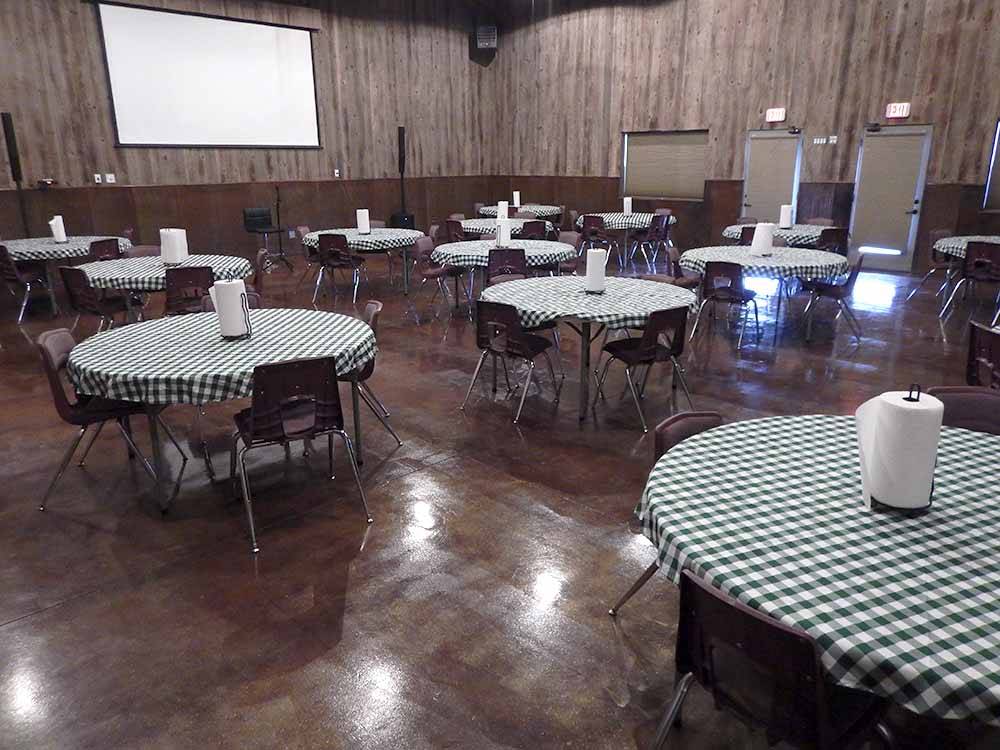 Round tables inside of the event center at HEARTLAND RV PARK & CABINS