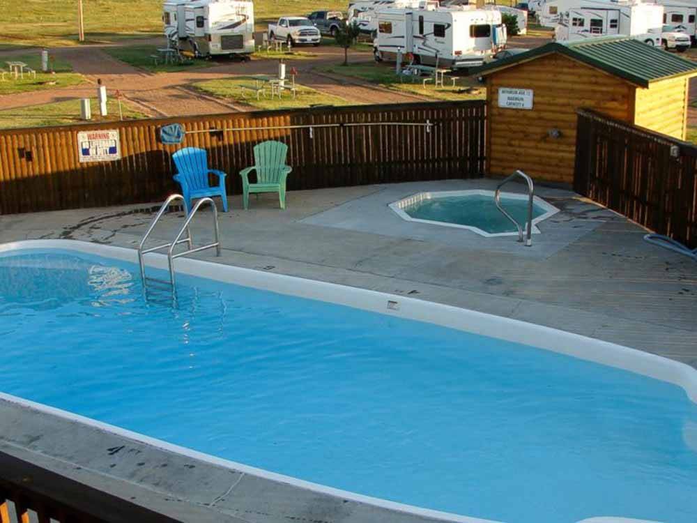 The fenced in swimming pool at HEARTLAND RV PARK & CABINS