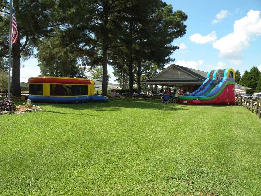 Inflatable jumping house and slide near the pavilion at Tranter's Creek Resort & Campground