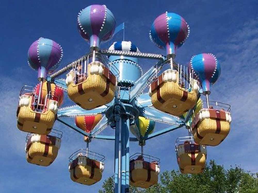 Attraction rides in the shapes of balloons and baskets at WYLIE PARK CAMPGROUND & STORYBOOK LAND
