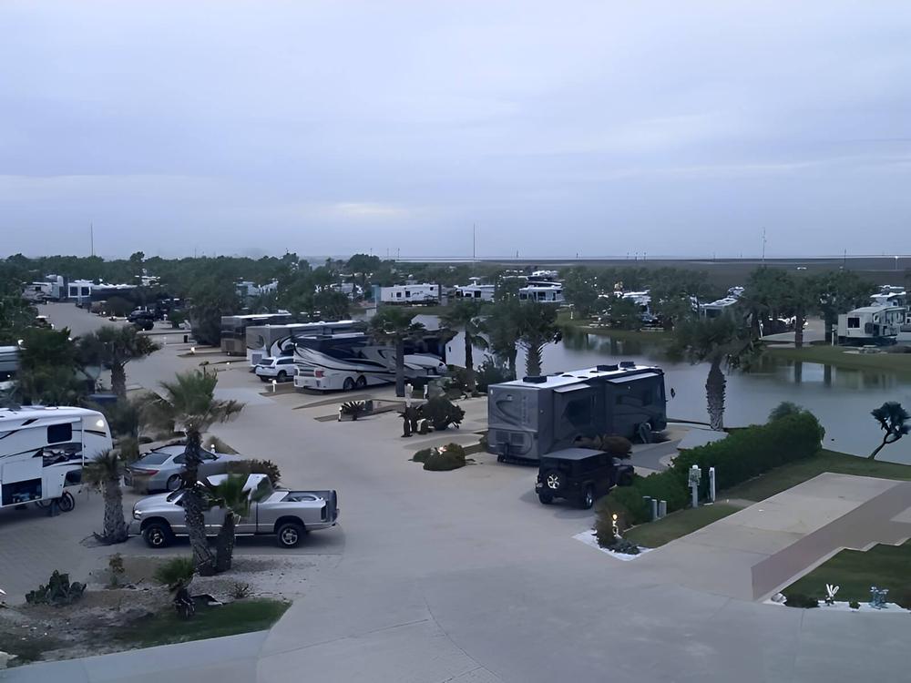 Parked RV's and trailer's at site Gulf Waters Beach Front RV Resort