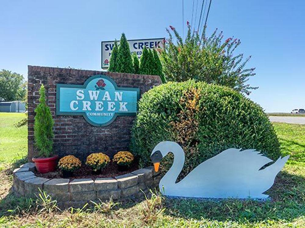 The front entrance sign with a swan cut out at SWAN CREEK COMMUNITY (MHP)