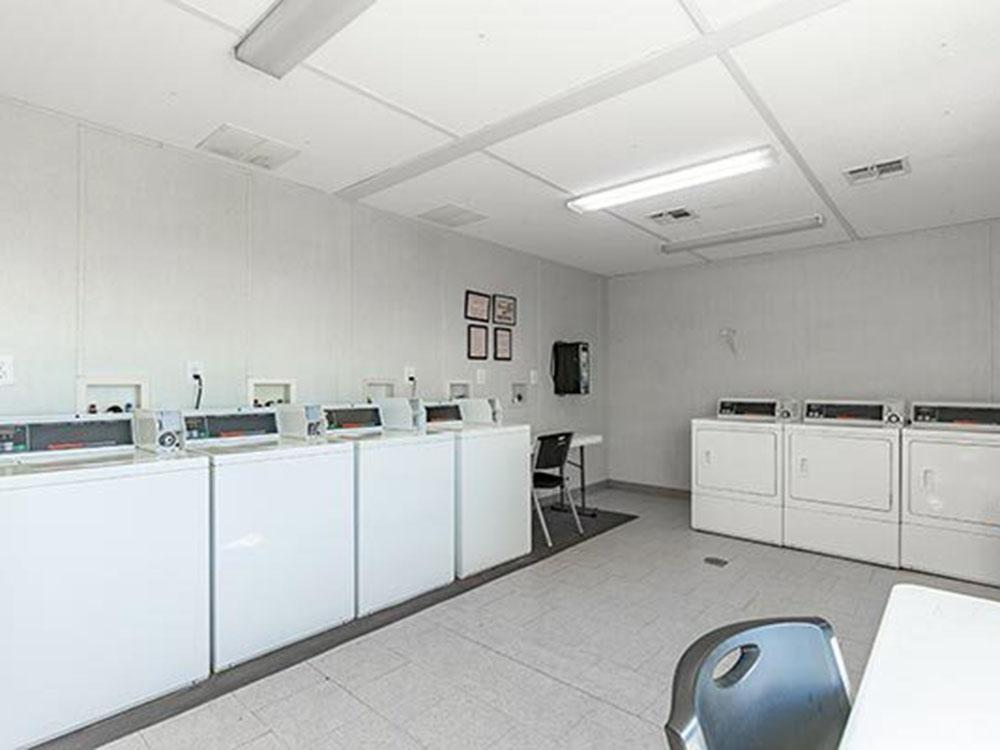 Washers and dryers in the laundry room at SWAN CREEK COMMUNITY (MHP)