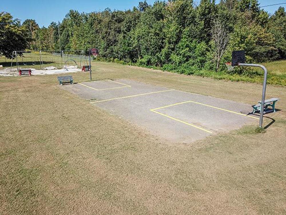 Aerial view of the basketball court and playground at SWAN CREEK COMMUNITY (MHP)