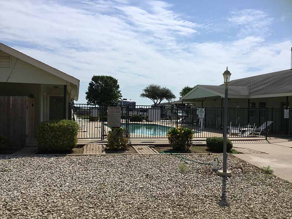The fenced in swimming pool at NEW LIFE RV PARK
