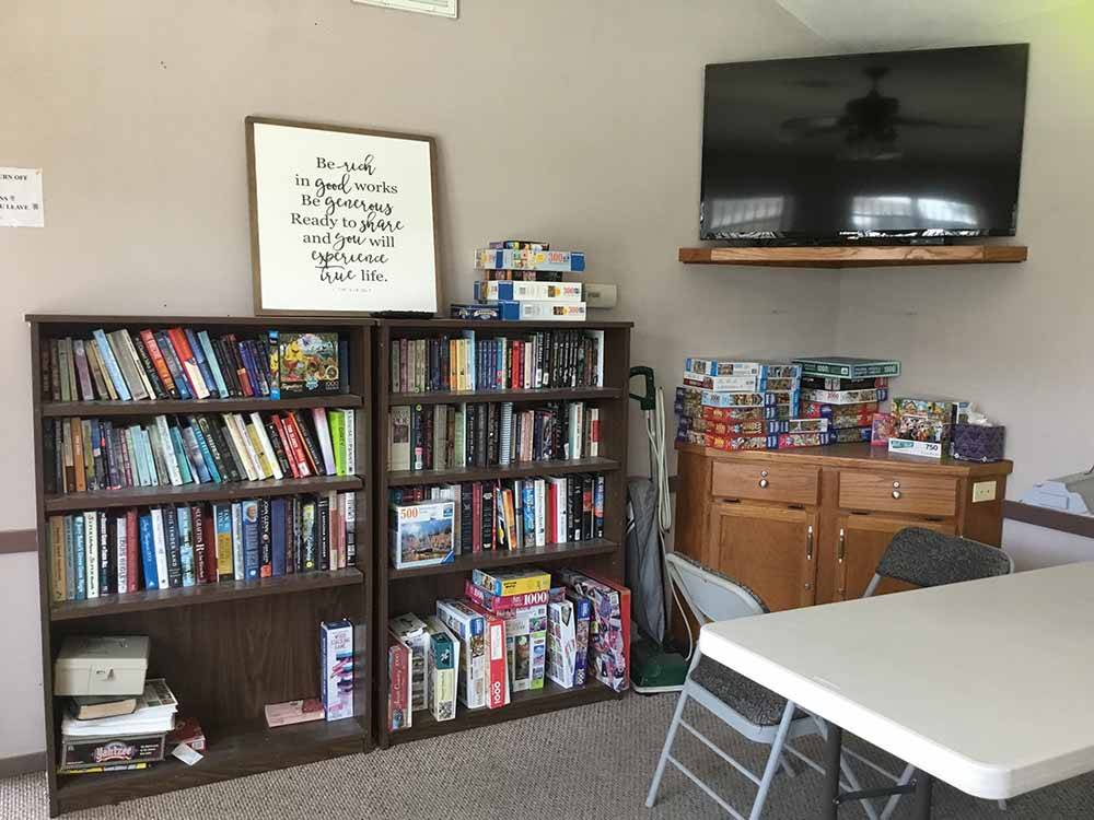 The lending library with a TV at NEW LIFE RV PARK