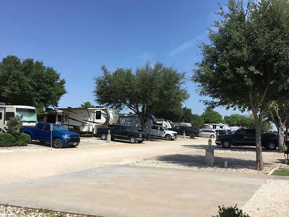 Two rows of gravel RV sites at NEW LIFE RV PARK