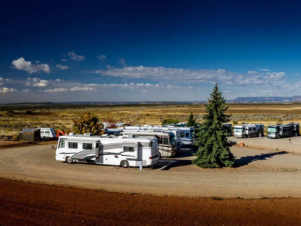 Aerial view of multiple RVs parked on dirt road at BLUE MOUNTAIN RV AND TRADING