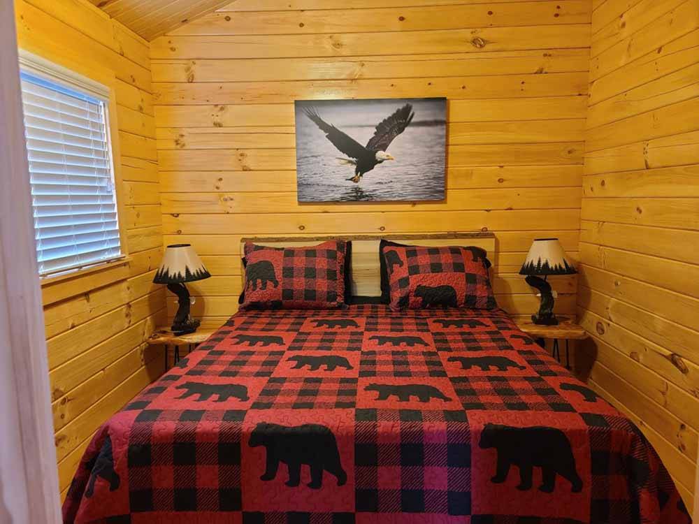 A bed in the rental cabin at MOUNTAIN PINES CAMPGROUND