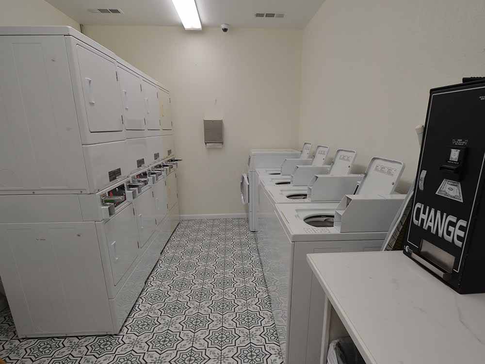 Inside of the clean laundry room at BLUEBONNET RIDGE RV PARK & COTTAGES