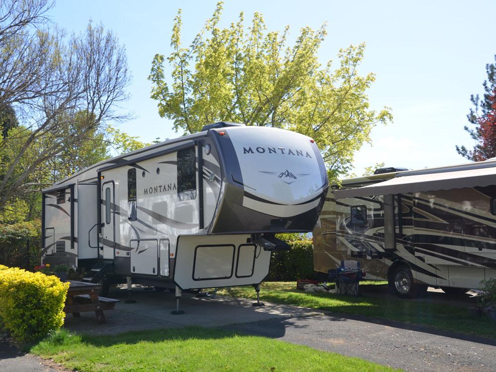 Fifth-wheel parked at site at JACK'S LANDING RV RESORT