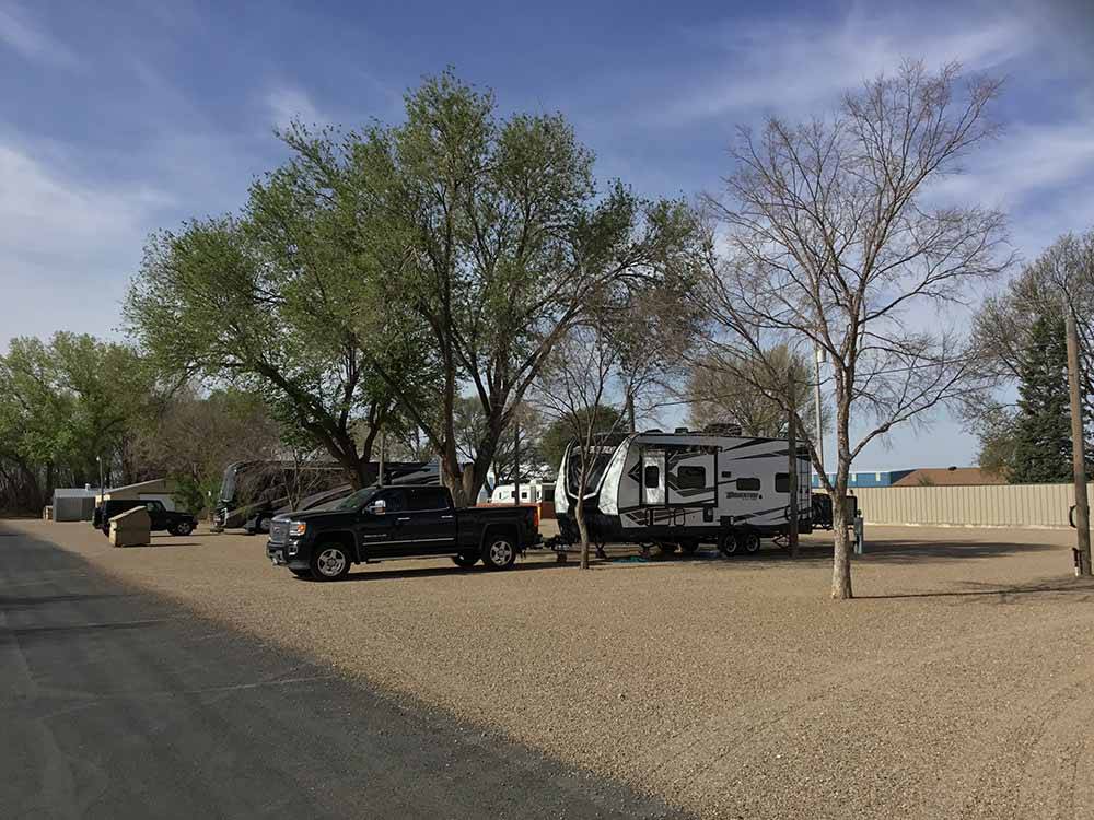 A group of gravel RV sites at CORRAL RV PARK