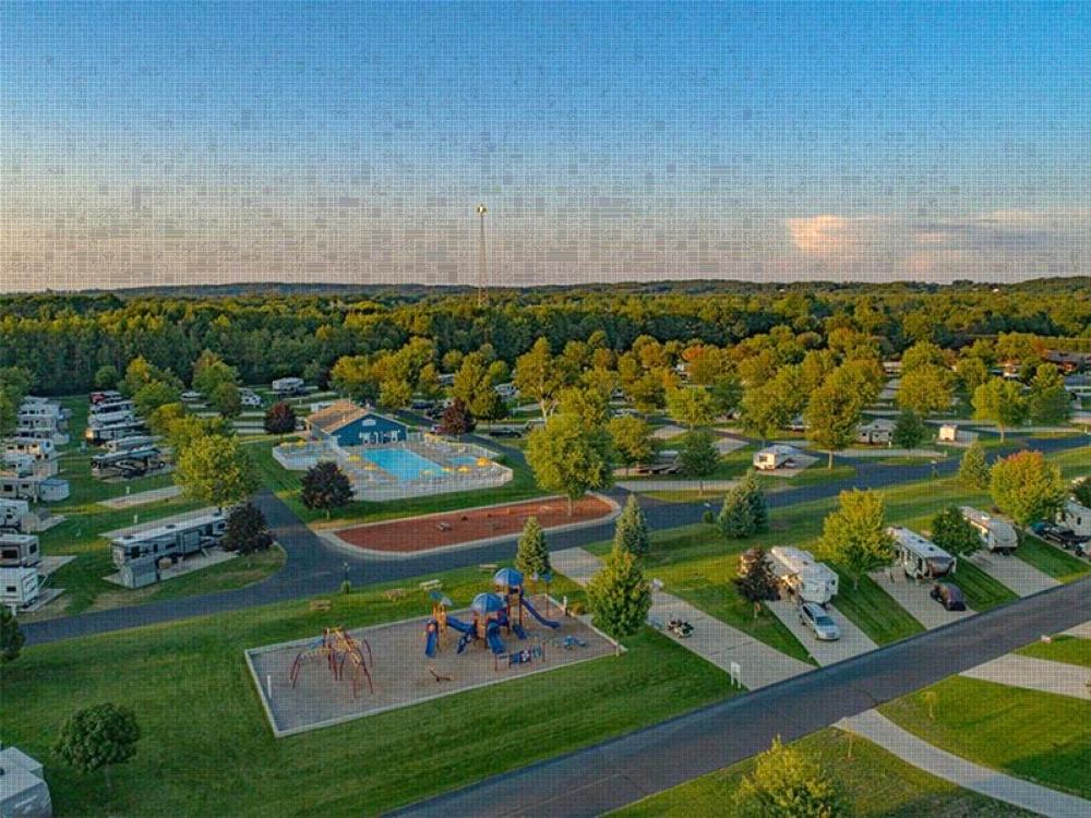 RV's parked with pool and park at site Sun Retreats Silver Lake