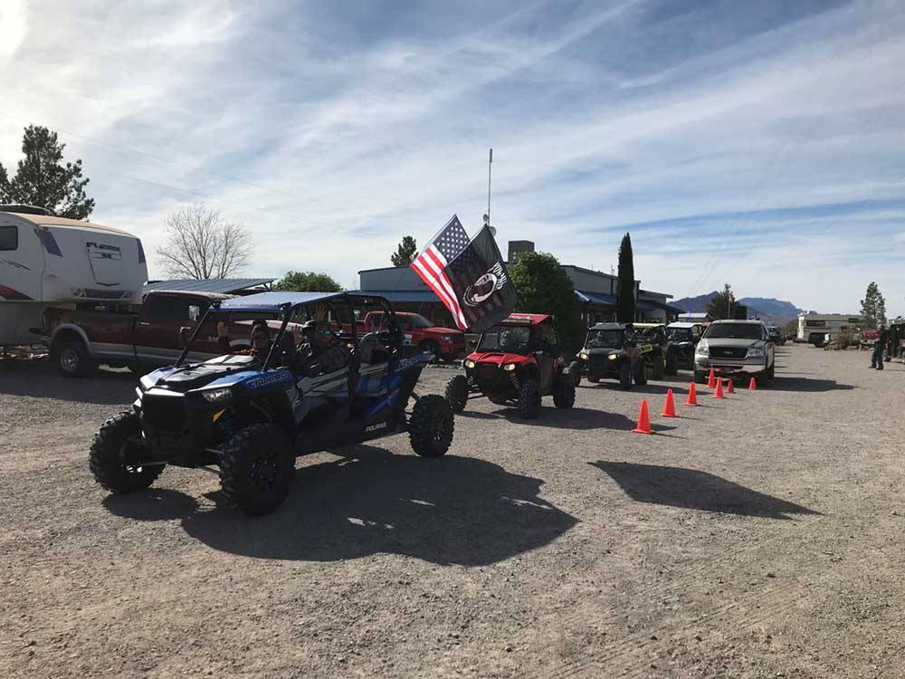 Side by side ATVs lined up at CEDAR COVE RV PARK