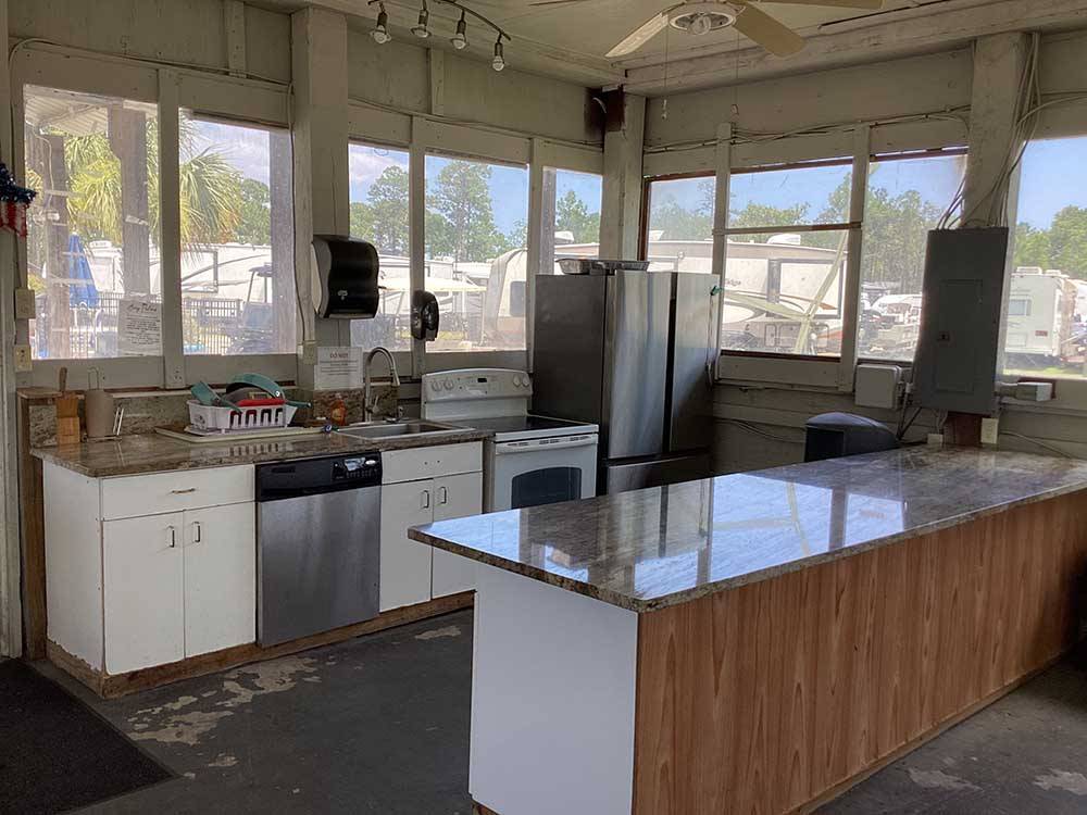 The kitchen area with a long counter at BAY PALMS RV RESORT