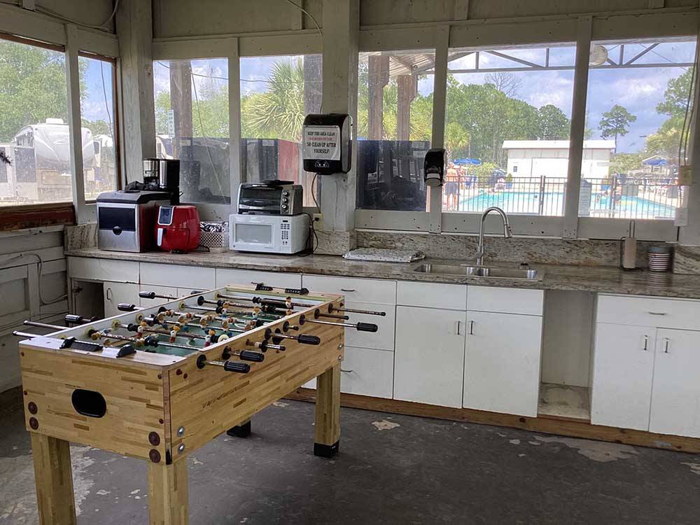 A foosball table in the kitchen area at BAY PALMS RV RESORT