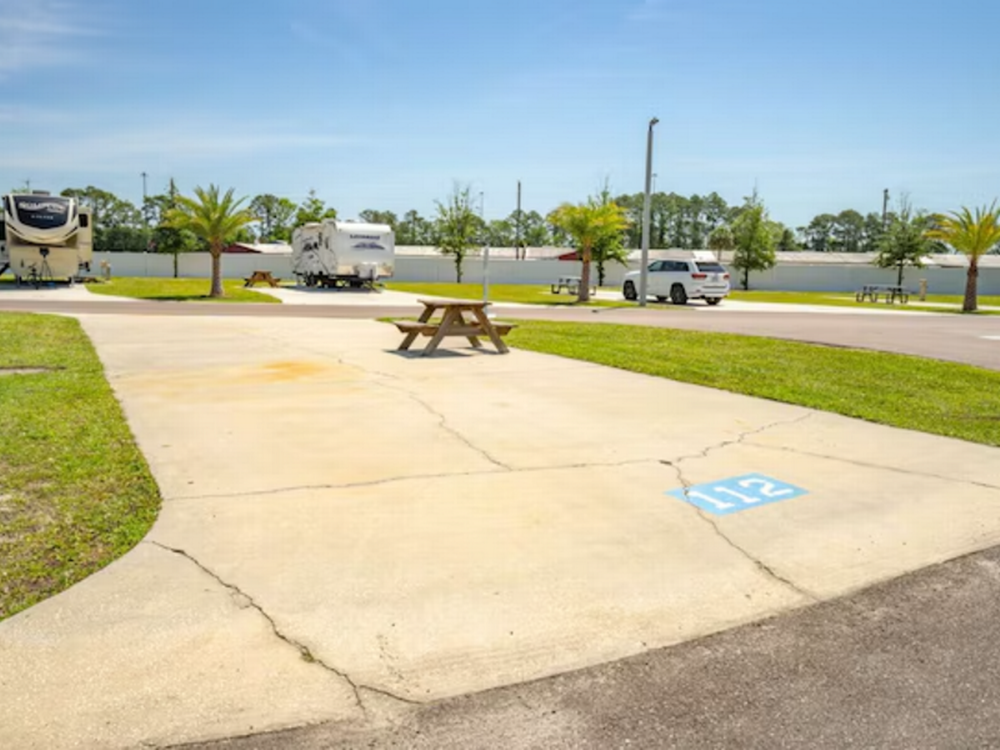Picnic table on site Pecan Park Sun RV Communities