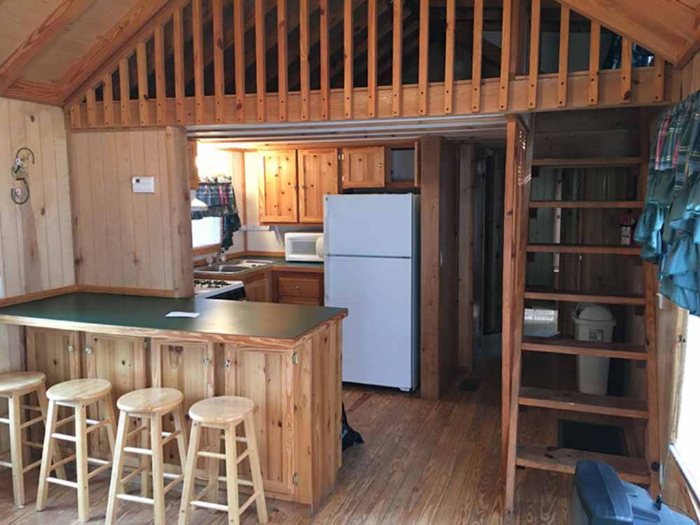 The kitchen area in the cabin rental at SCHROON RIVER CAMPGROUND & LODGING