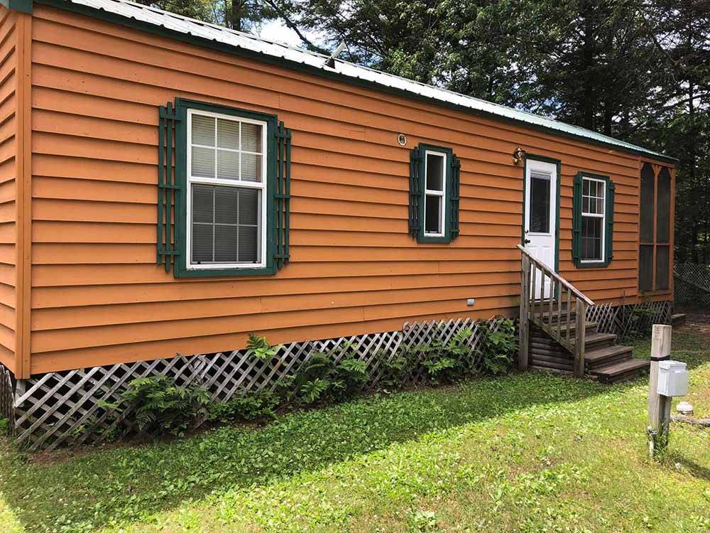 The side view of the cabin at SCHROON RIVER CAMPGROUND & LODGING