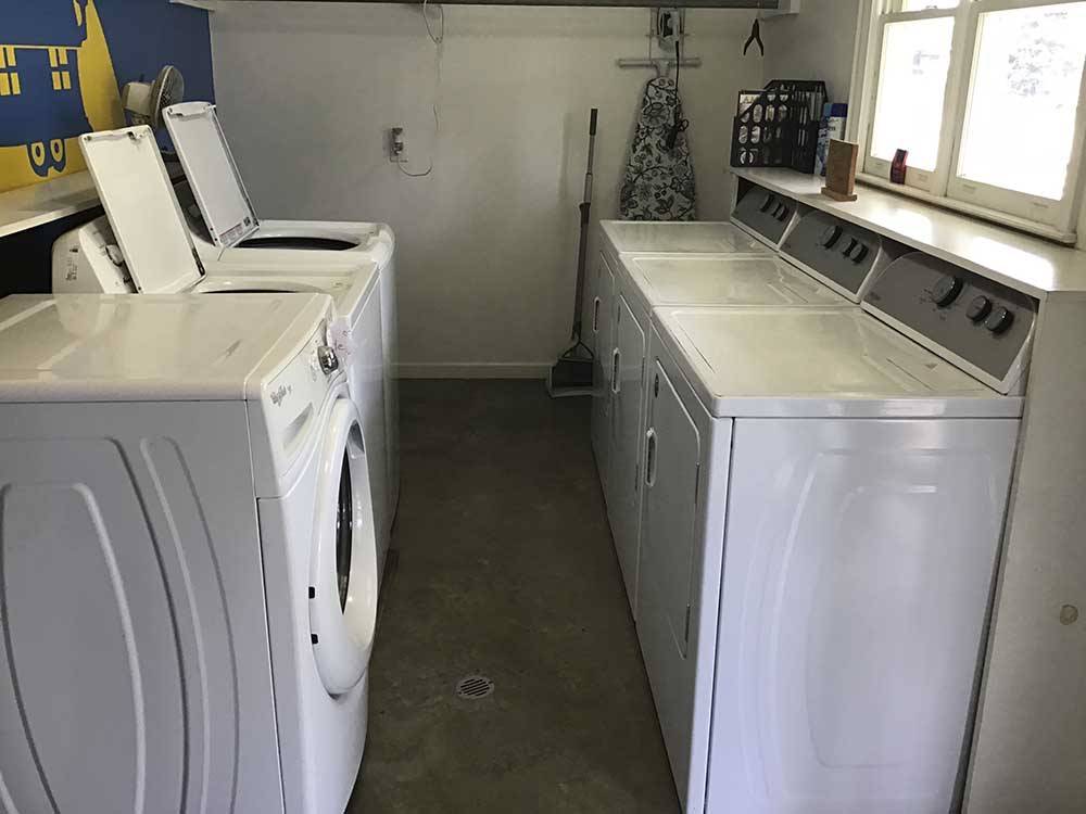 Inside of the clean laundry room at HARVEST MOON RV PARK