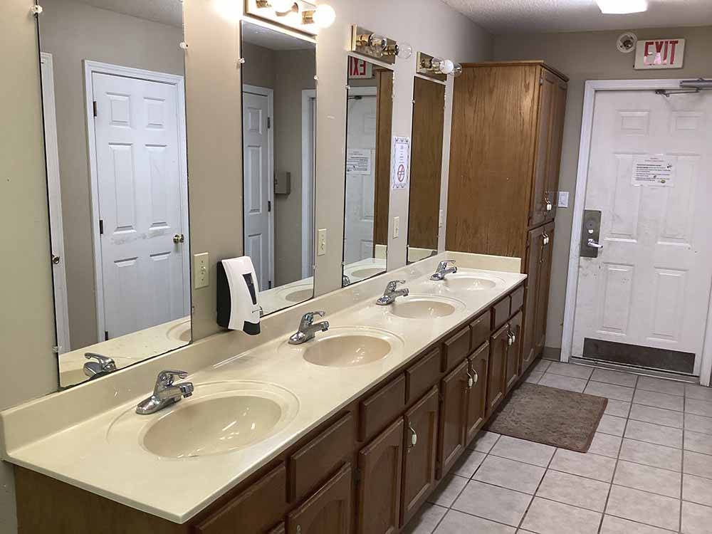 The clean sinks in the bathrooms at MEMPHIS-SOUTH RV PARK & CAMPGROUND