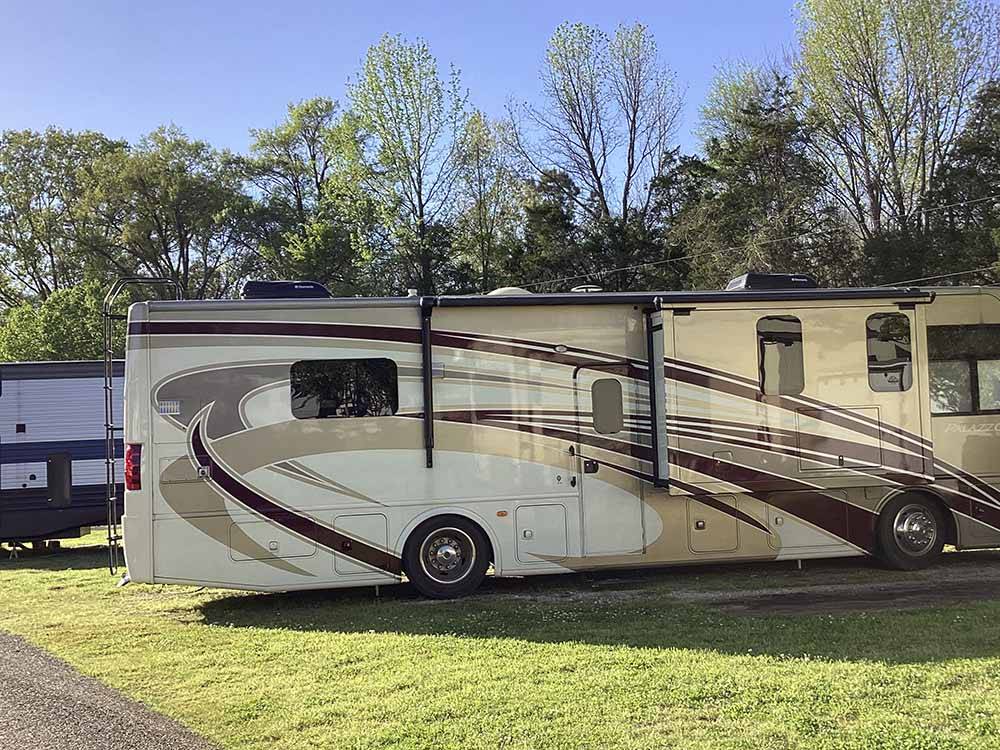 A motorhome in a paved RV site at MEMPHIS-SOUTH RV PARK & CAMPGROUND